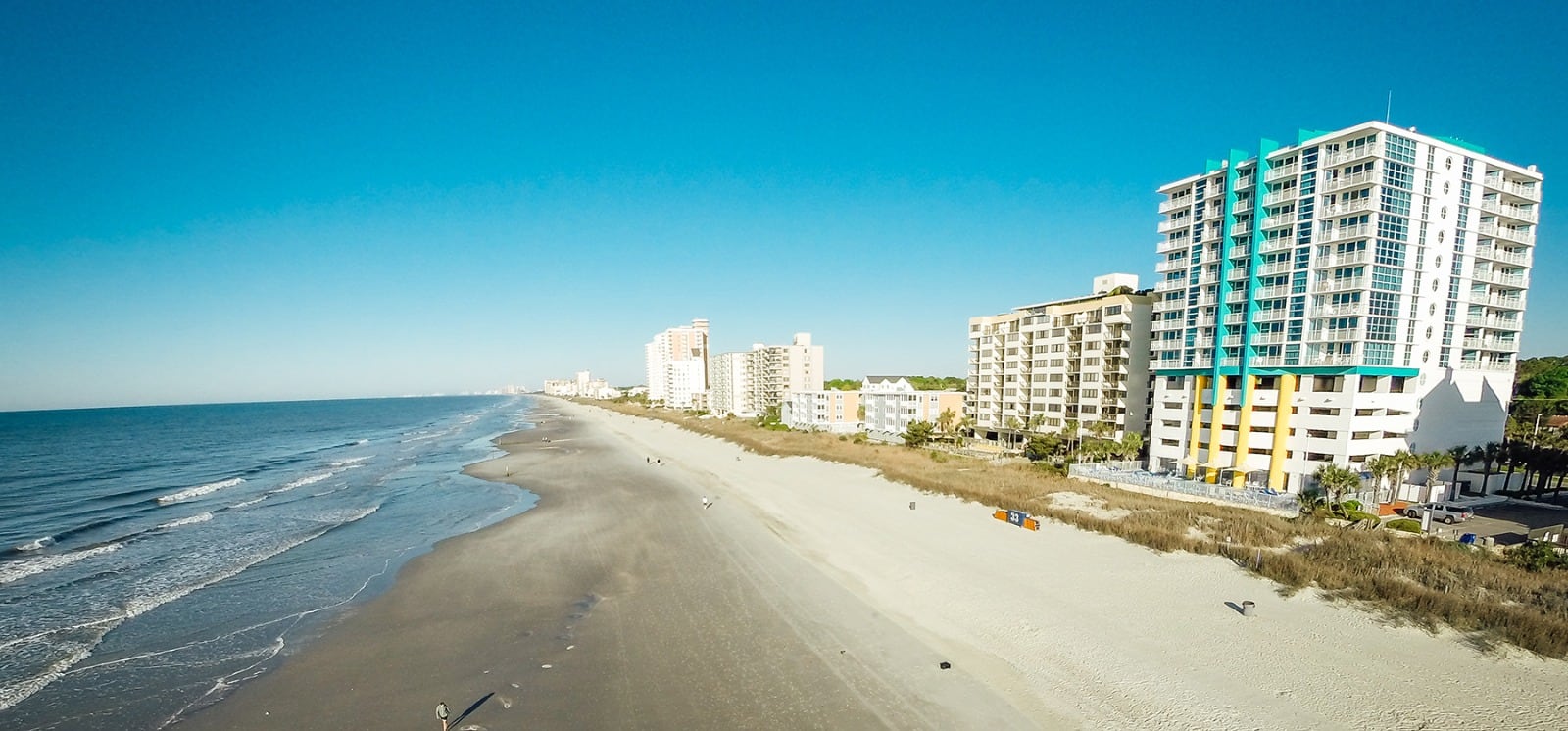 An overview shot of Myrtle Beach during the day with the resort in view on the right.