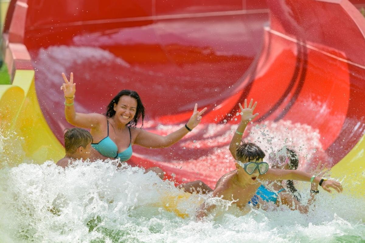 Family on a water slide in the water park